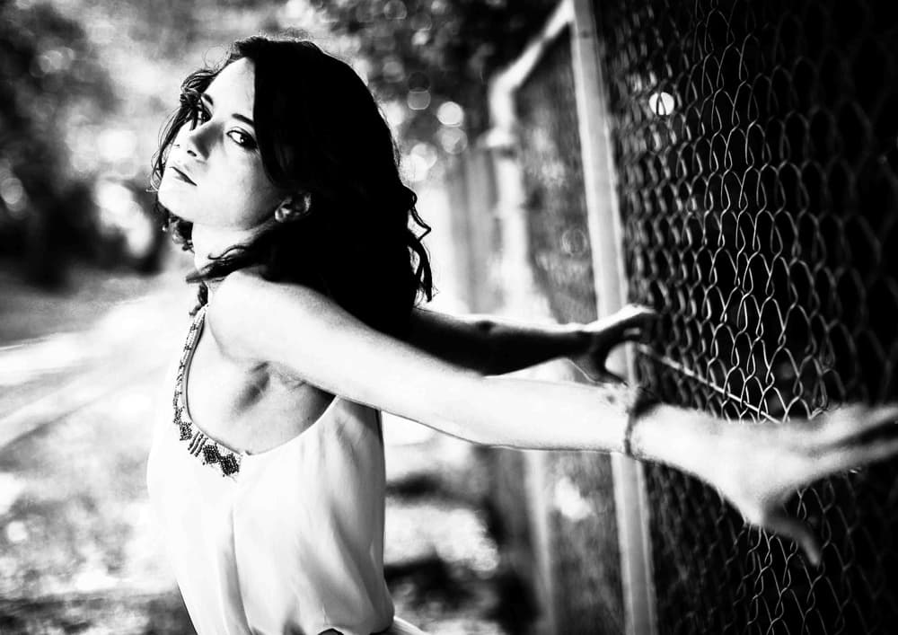 Pensive Woman At Fence by TORU MATSUNAGA — canvas wall art