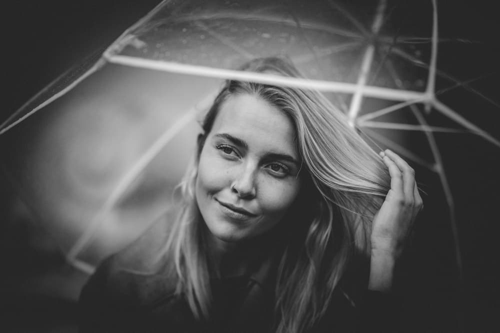 Thoughtful Blonde Under Umbrella by Steffen Lauterbach — canvas wall art