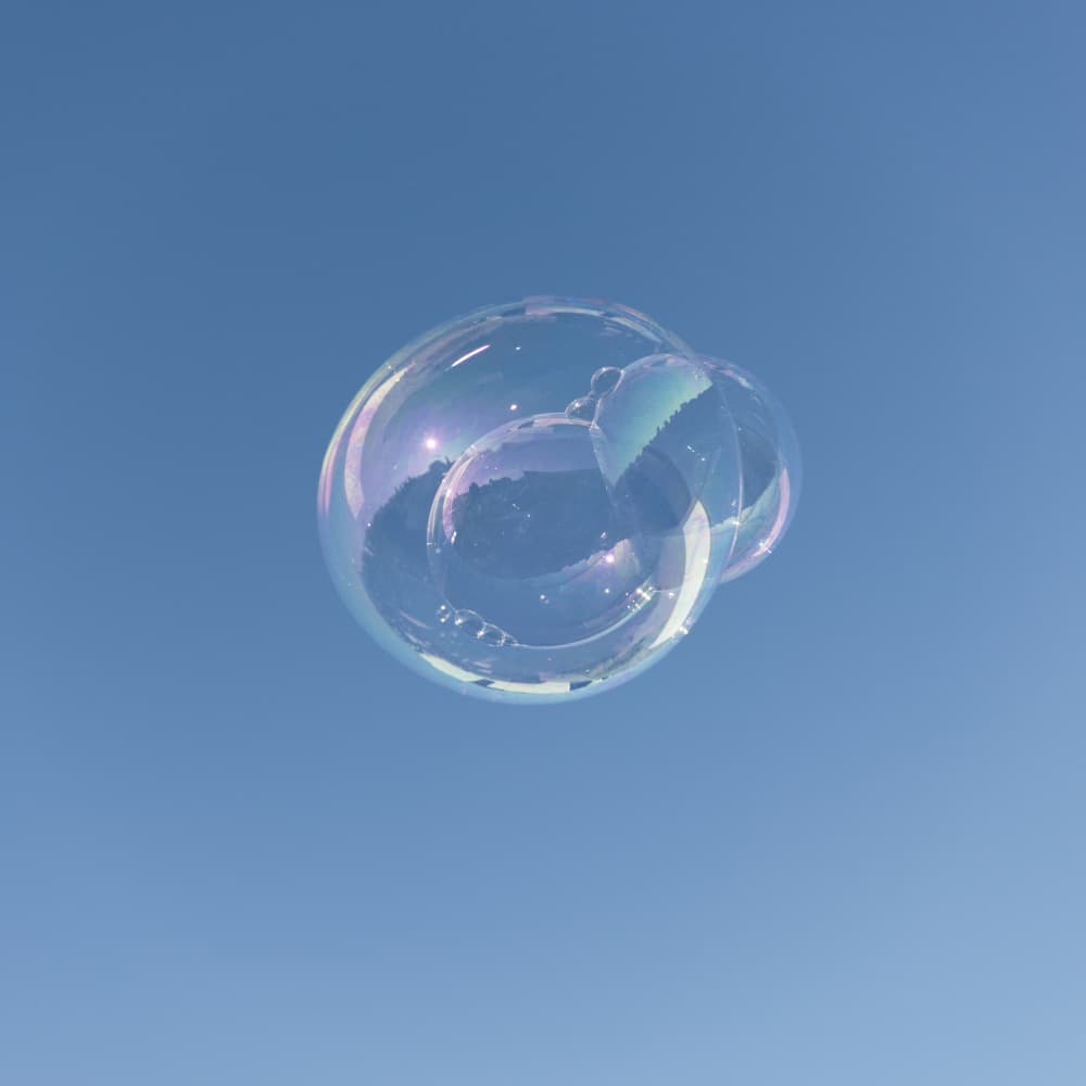 Floating Iridescent Bubbles by Lynann Colligan — canvas wall art