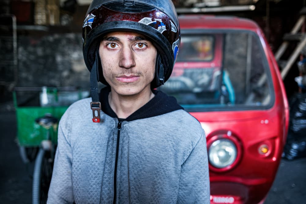 Young Man Helmet Portrait by Ali Ayer — canvas wall art