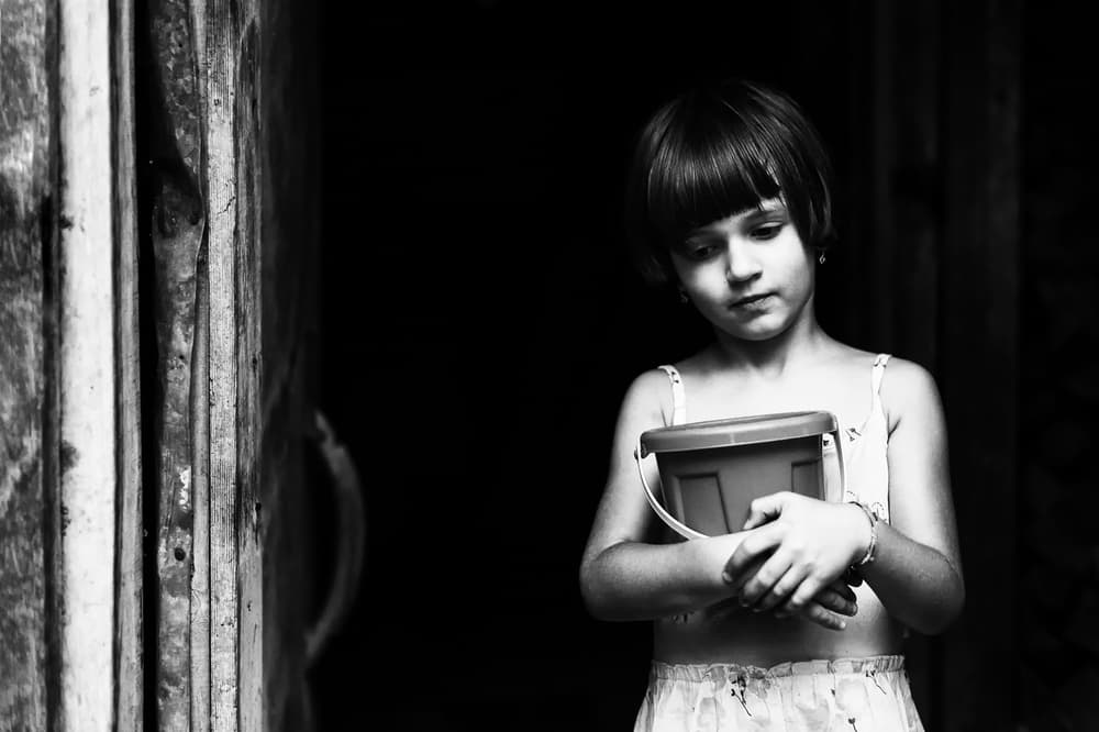 Pensive Girl with Bucket by Marius Cinteza — canvas wall art