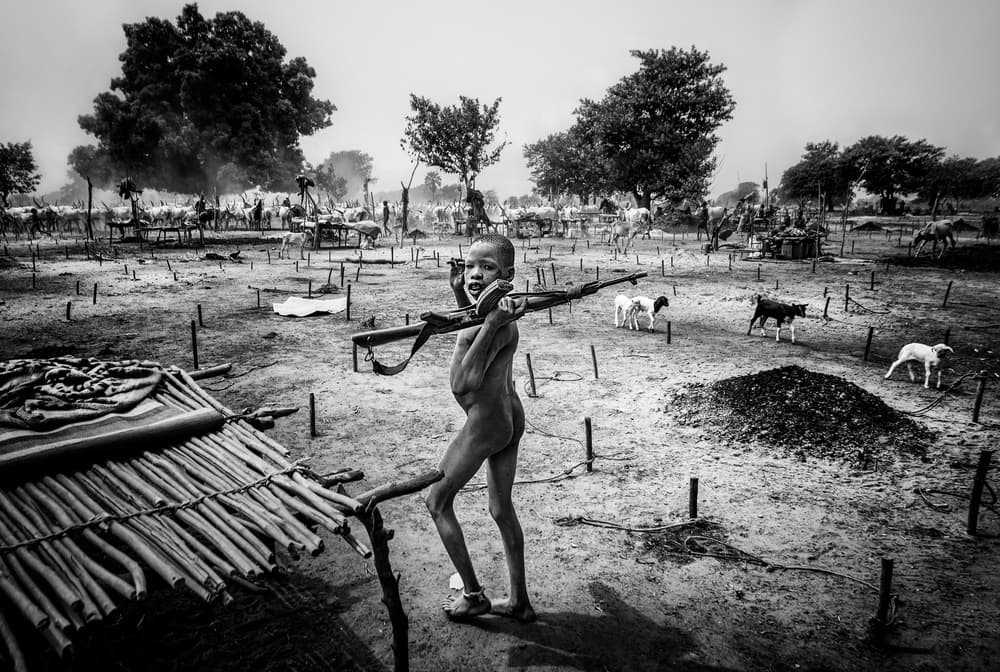 African Child with Weapon by Joxe Inazio Kuesta Garmendia — canvas wall art