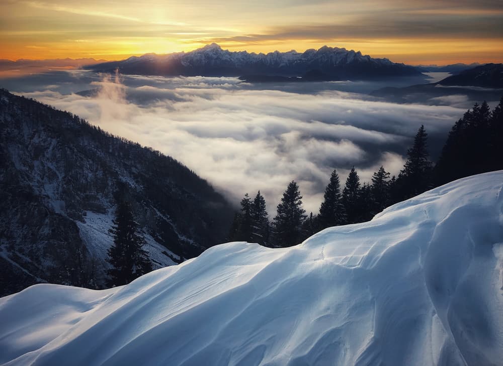 Winter Sunset Over Clouds by Ales Krivec — canvas wall art