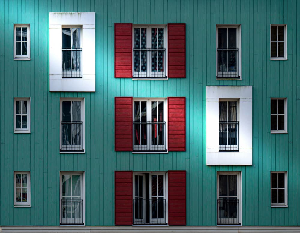 Red Shutters Teal Wall by Roland M Schwerdtfeger — canvas wall art