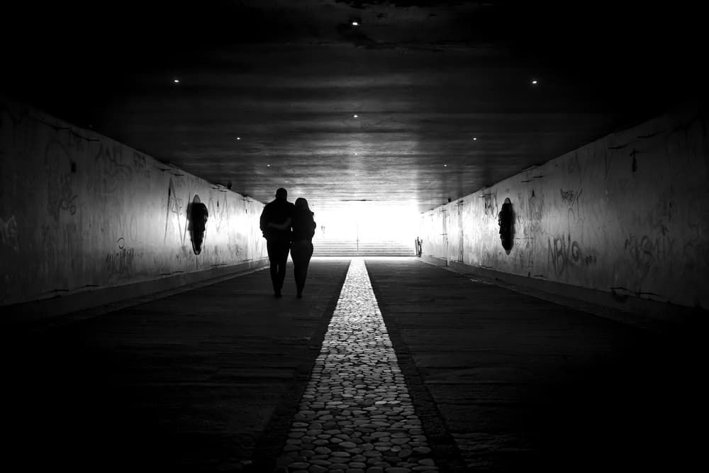 Couple Walking Tunnel Light by Marius Surleac — canvas wall art