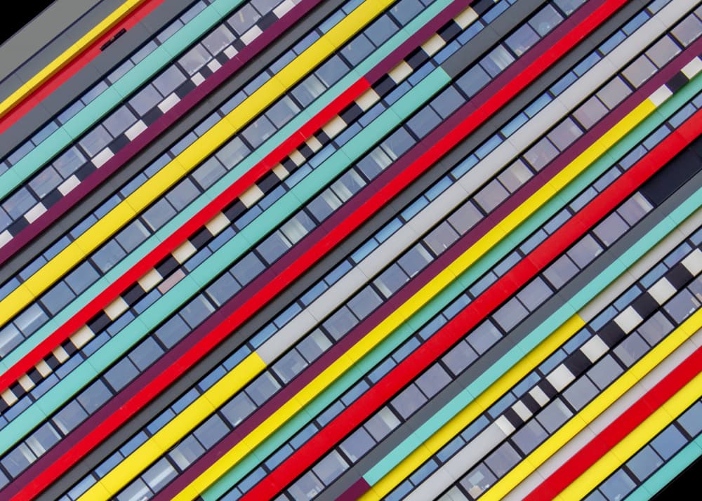 Vibrant Building Stripes by Theo Luycx — canvas wall art