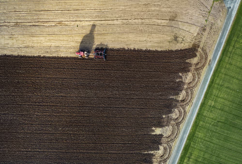 Tractor Plowing Farmland by Shenshen Dou — canvas wall art