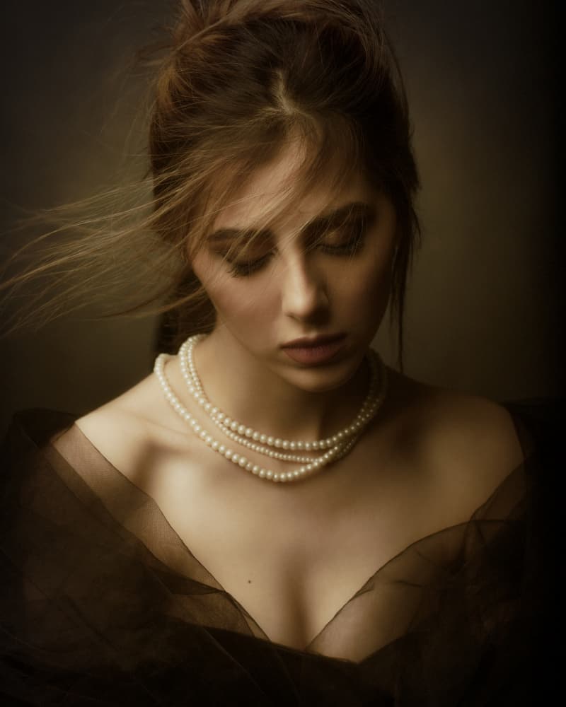 Pensive Woman with Pearls by Mehdi Mokhtari — canvas wall art