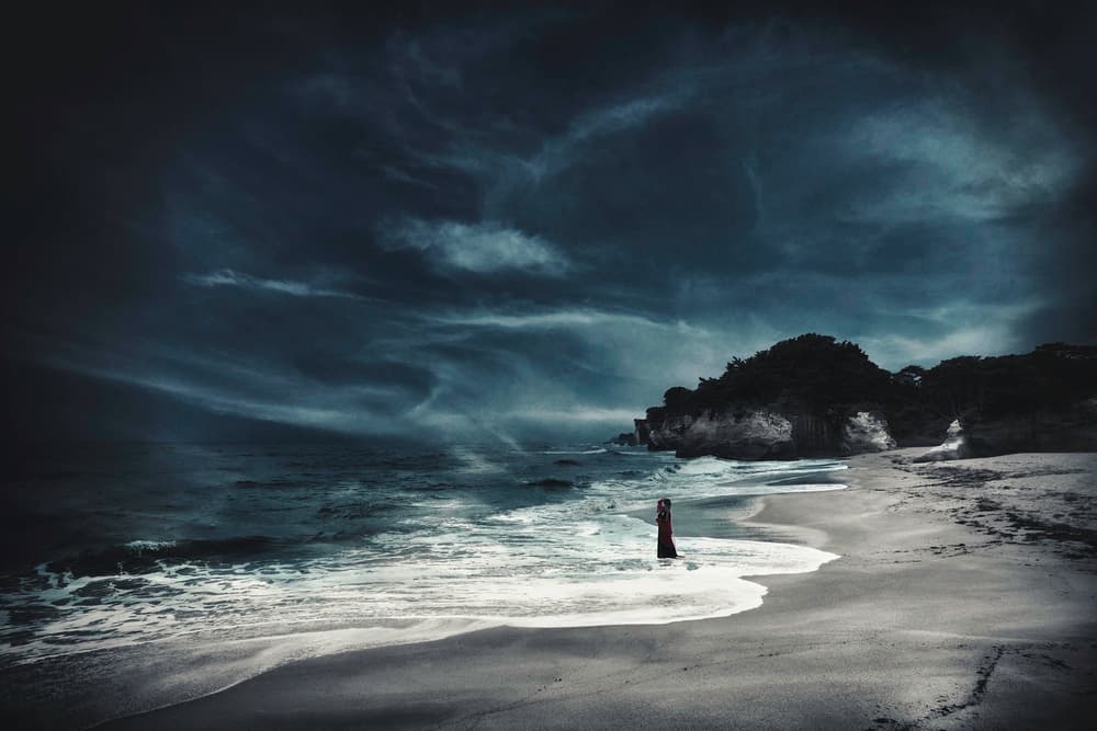 Red Dress Stormy Beach by KOIKI — canvas wall art
