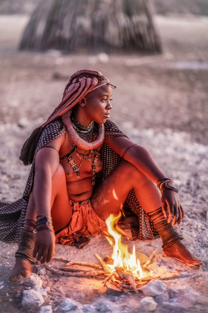 Himba Woman by Fire by Trevor Cole — canvas wall art
