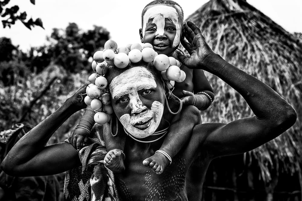 Mother Child Tribal Portrait by Joxe Inazio Kuesta Garmendia — canvas wall art