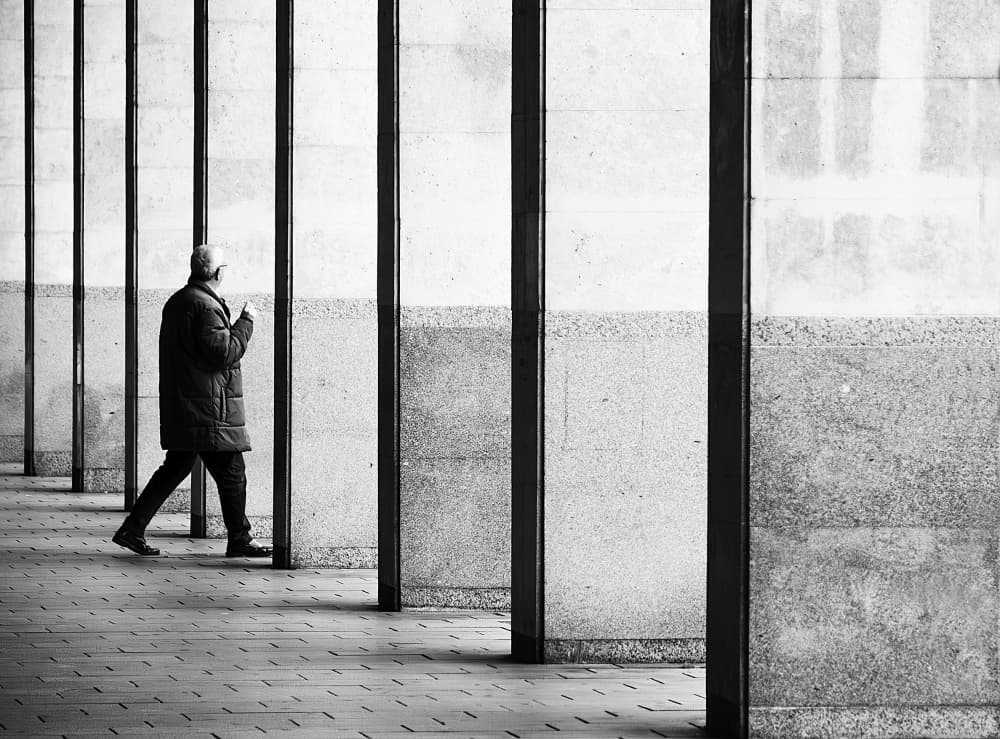 Lone Figure Urban Walk by Adolfo Urrutia — canvas wall art