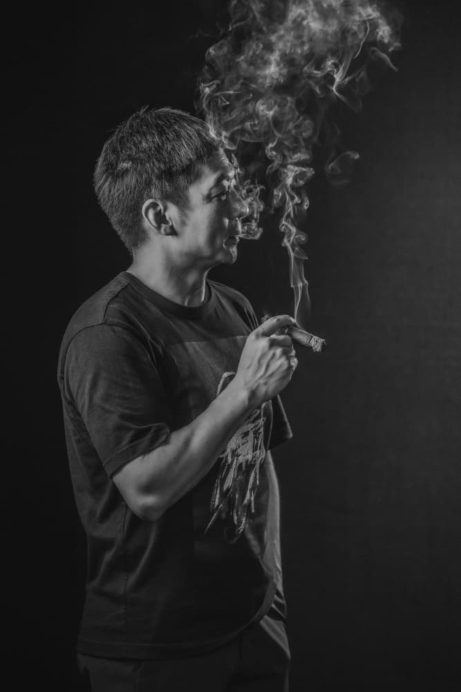 Pensive Man Smoking Cigar by qiye — canvas wall art
