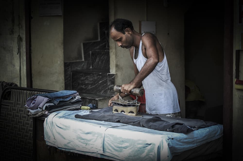 Ironing Man at Work by Eyal Alcalay — canvas wall art