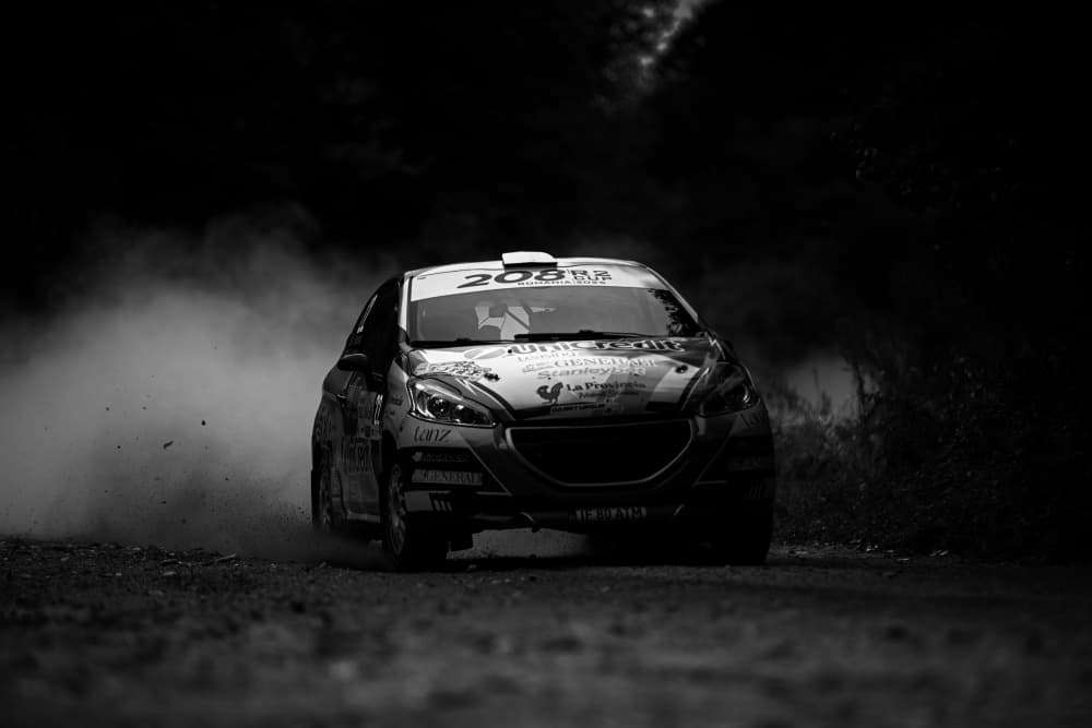 Speeding Rally Car Dust by Julien Oncete — canvas wall art