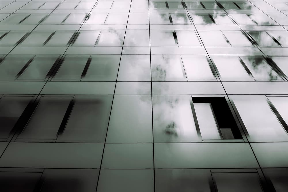 Glass Building Reflections by Elena Raceala — canvas wall art