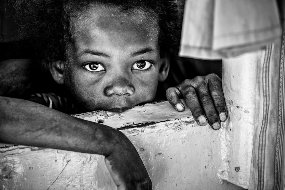 Intense Child's Gaze by Marco Tagliarino — canvas wall art