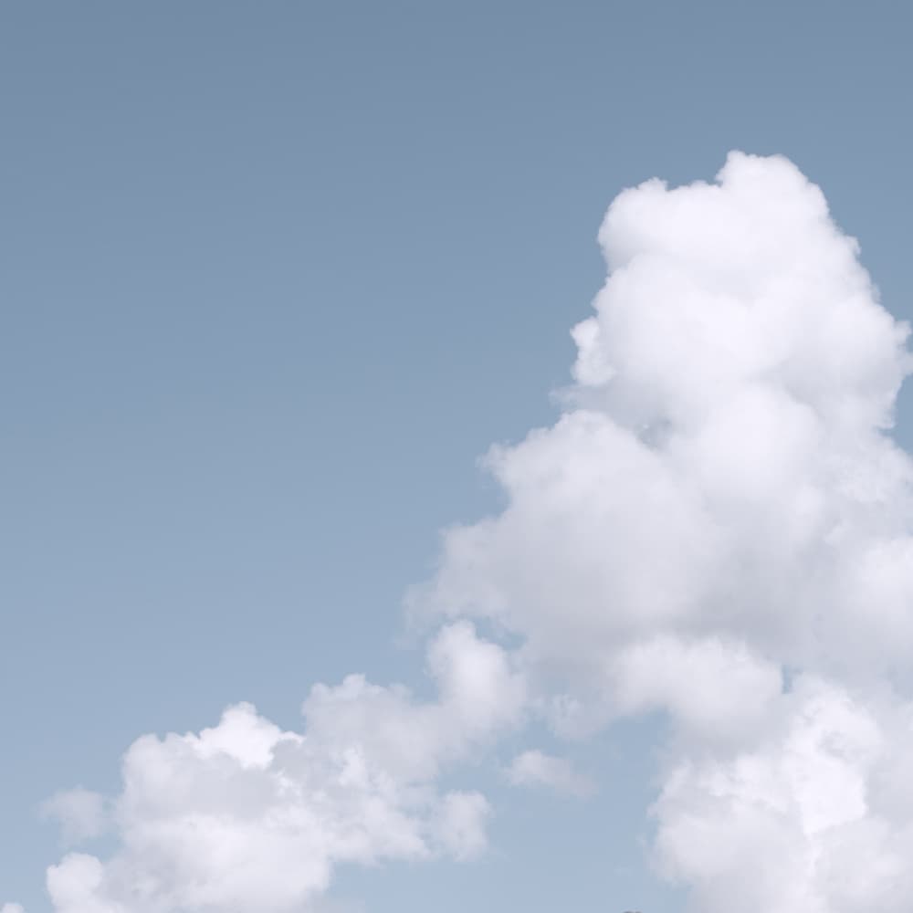 Fluffy Blue Sky by Lynann Colligan — canvas wall art