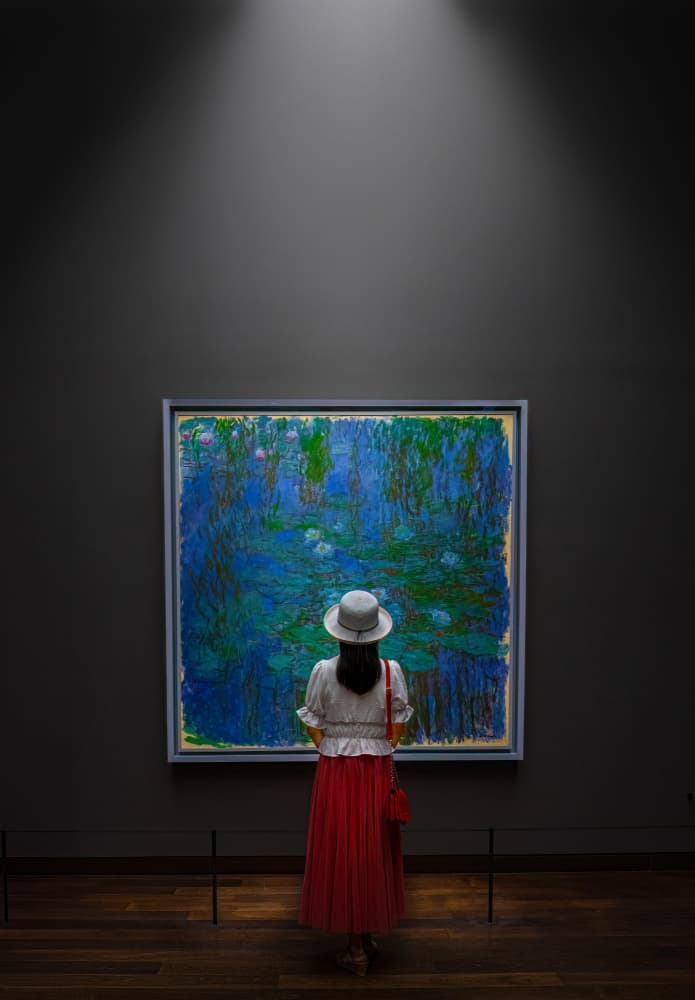 Woman Admiring Water Lilies by Kenneth-Wei Zeng — canvas wall art