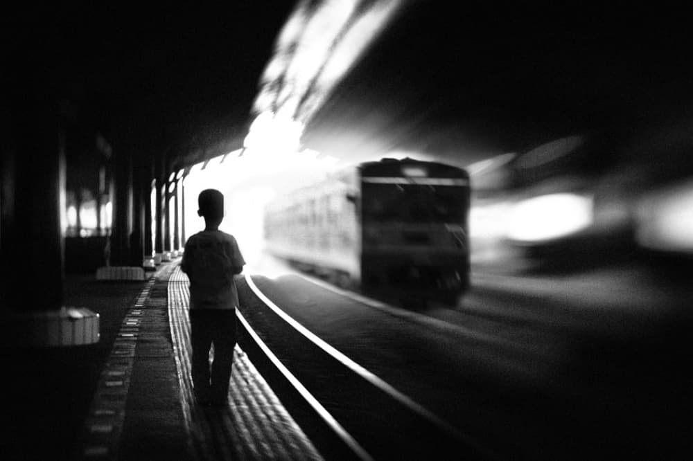 Boy On Train Platform by Sebastian Kisworo — canvas wall art