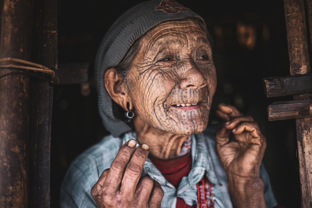 Smiling Tattooed Elder by Marco Tagliarino — canvas wall art