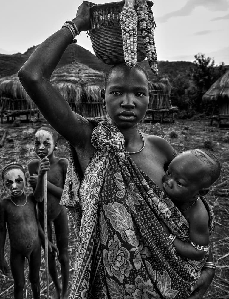 African Village Motherhood by Joxe Inazio Kuesta Garmendia — canvas wall art