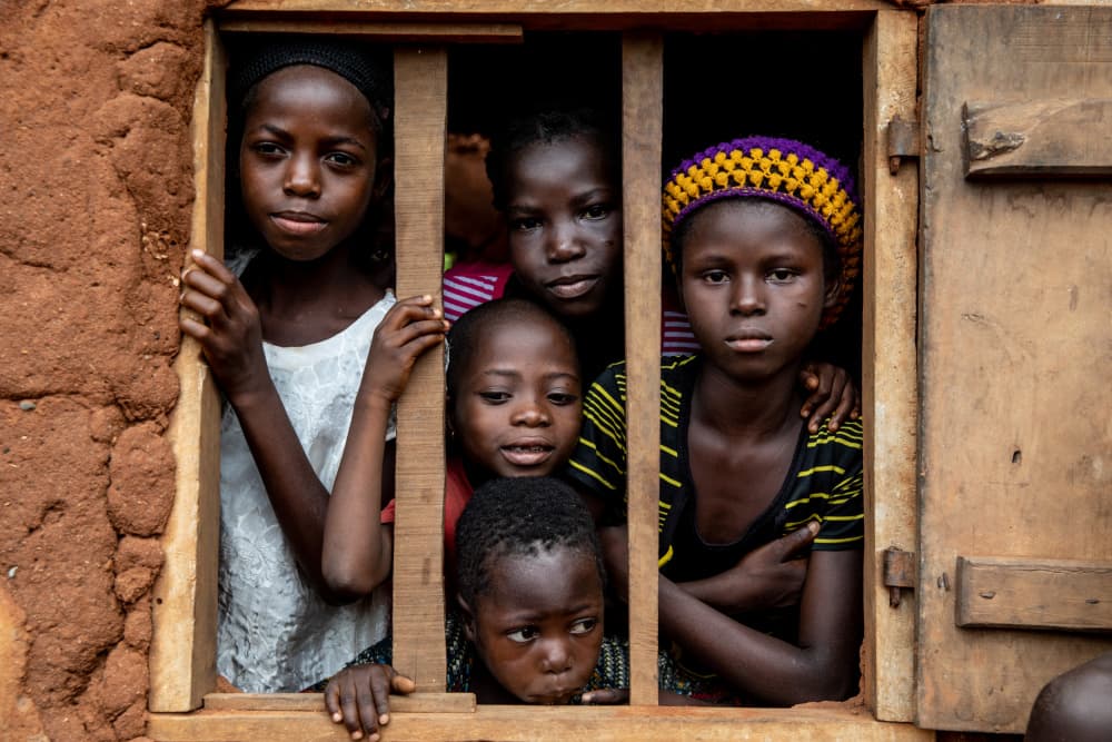 African Children Looking Out by Ella Waldman — canvas wall art