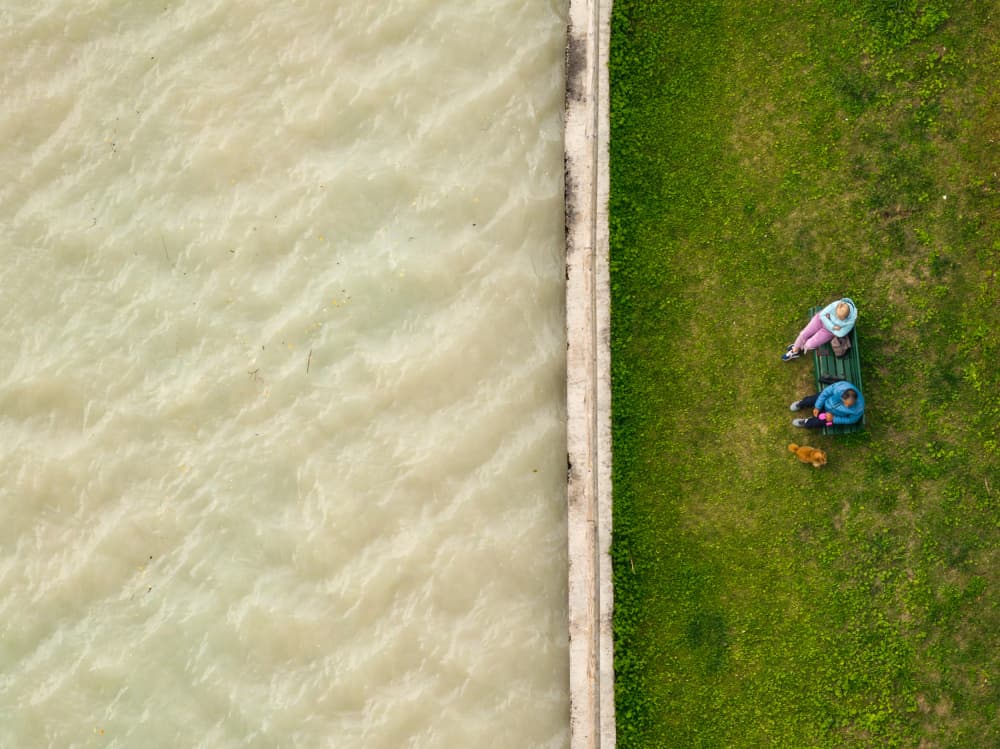 People Relaxing By Water by Jure Kravanja — canvas wall art
