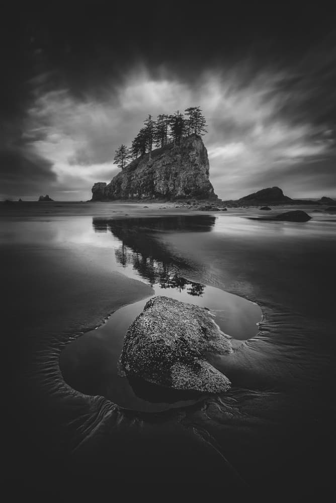 Moody Sea Stack Reflection by Lydia Jacobs — canvas wall art