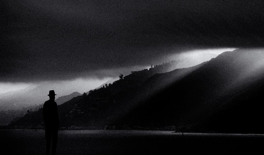 Man Beside Moody Lake by Roxana Labagnara — canvas wall art