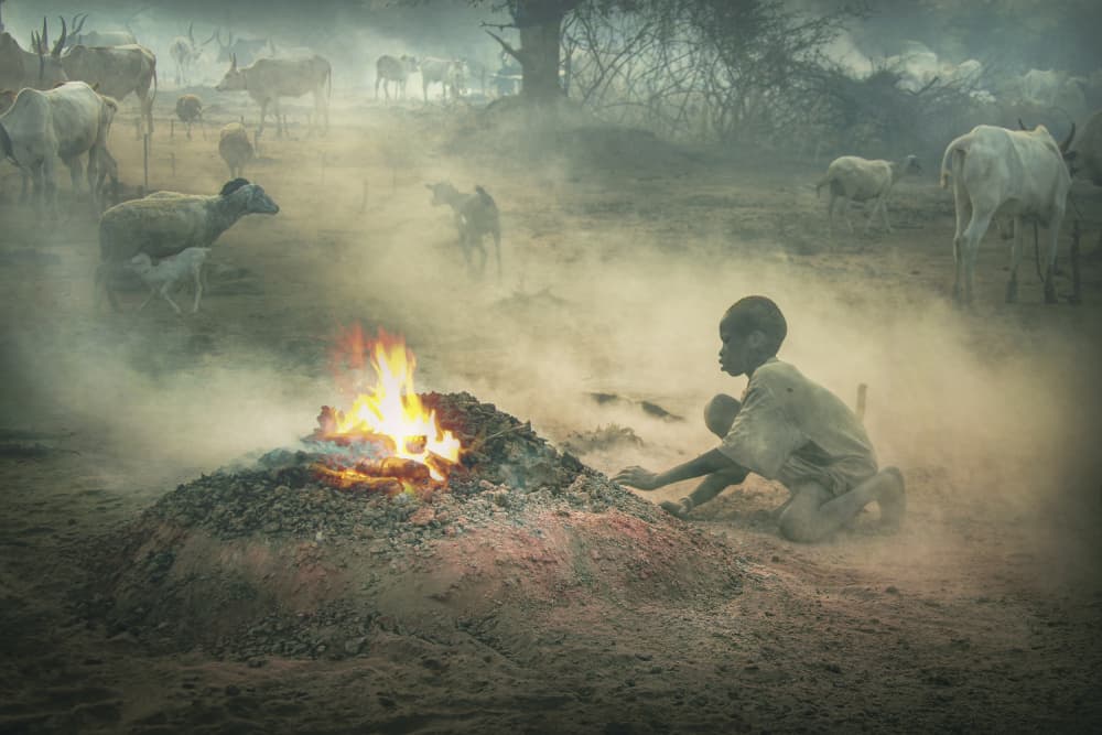 MUNDARI-SOUTH SUDAN Boy and his fire by Svetlin Yosifov — canvas wall art