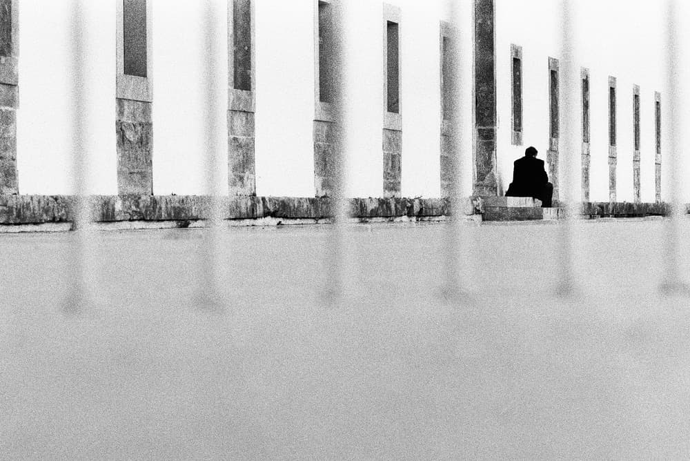 Urban Solitude Behind Rails by Paulo Abrantes — canvas wall art