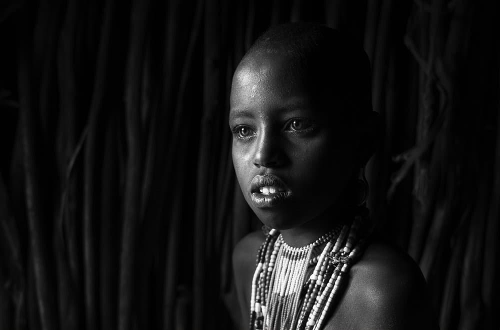 Pensive Young Girl by Sarawut Intarob — canvas wall art