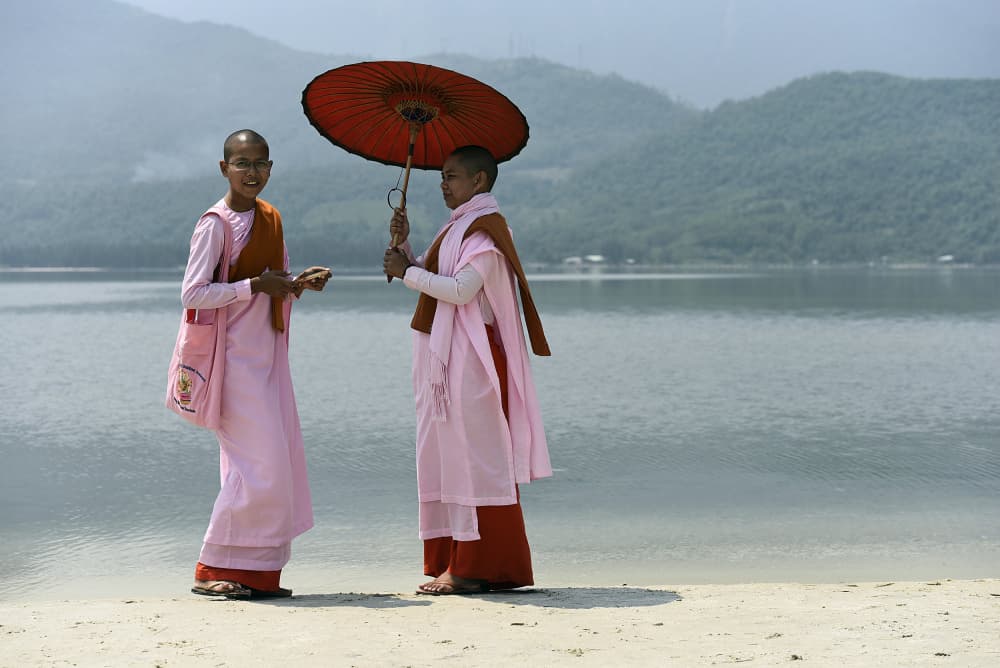 Smiling Nuns Lakeside Umbrella by Irene Perovich — canvas wall art