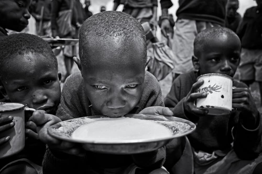 African Children's Meal by Goran Jovic — canvas wall art