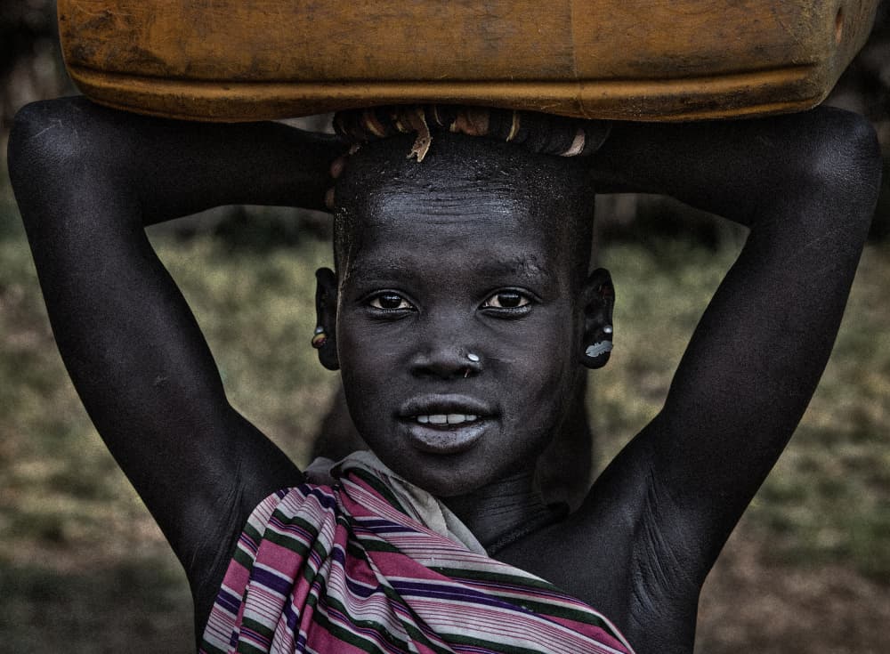 Smiling African Girl by Joxe Inazio Kuesta Garmendia — canvas wall art