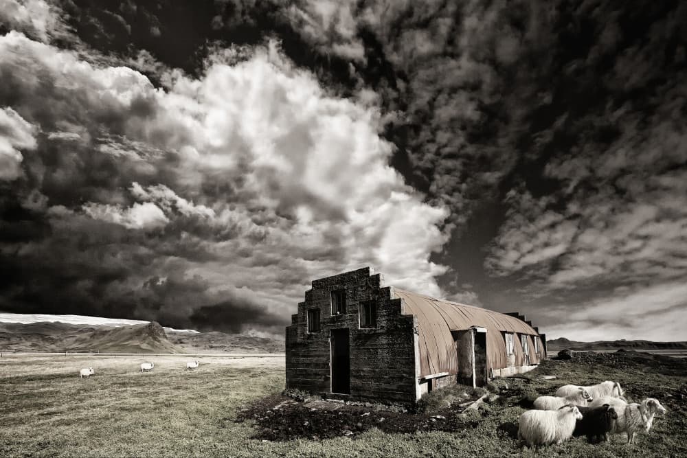 Rustic Barn Under Stormy Sky by Þorsteinn H. Ingibergsson — canvas wall art
