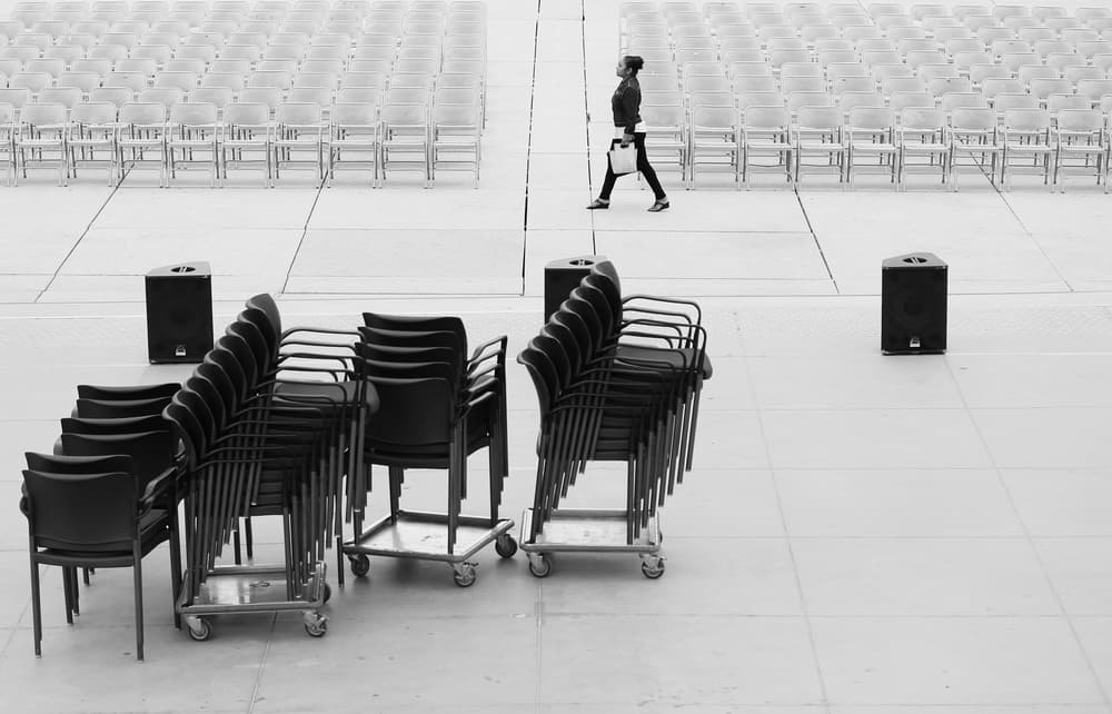 Solitary Figure Empty Chairs by Jian Wang — canvas wall art