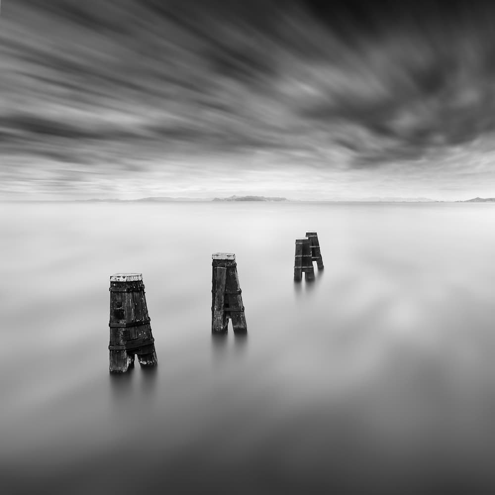 Moody Ocean Pilings by George Digalakis — canvas wall art