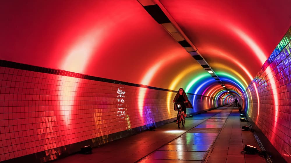 Rainbow Tunnel Cyclist by Lus Joosten — canvas wall art